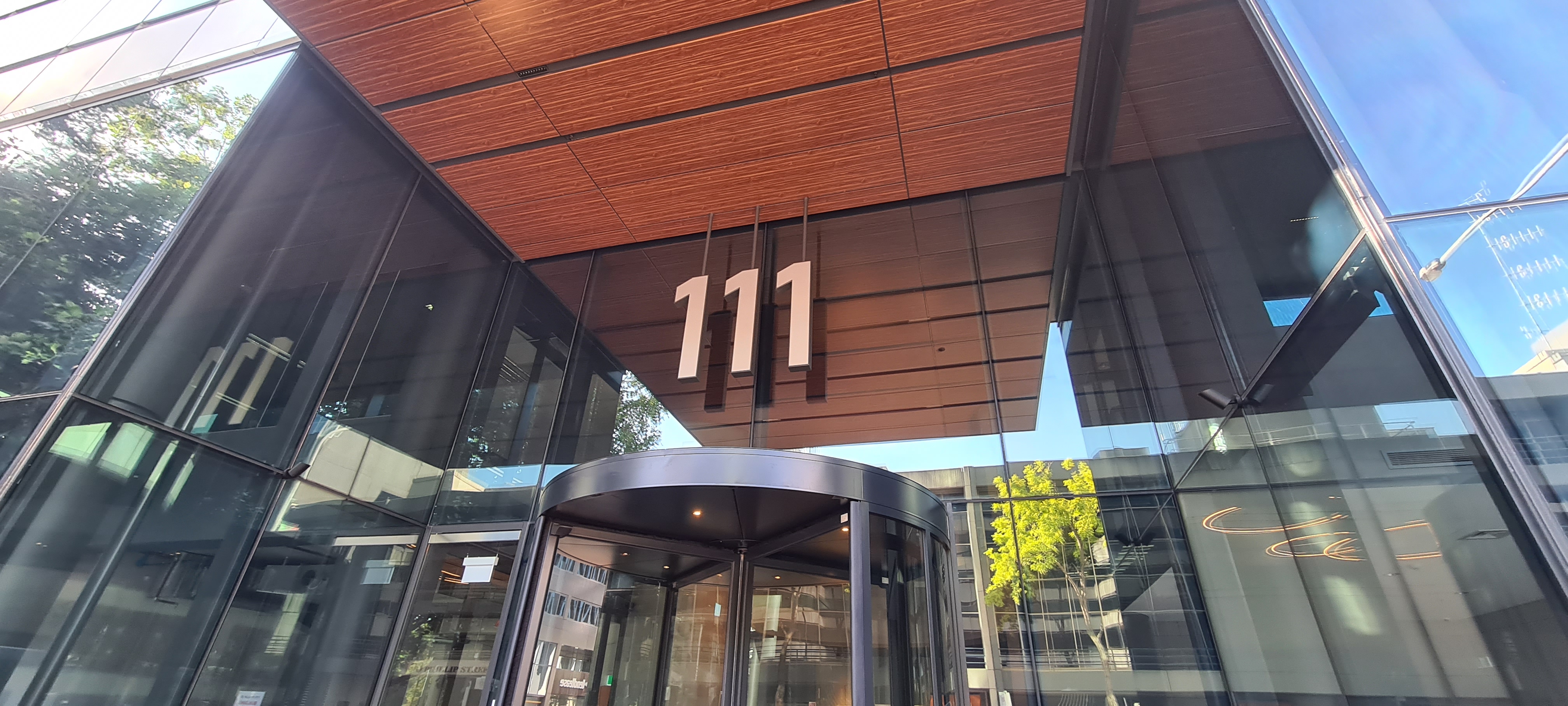 Refurbished glass entrance and street frontage at 111 Phillip Street, Parramatta